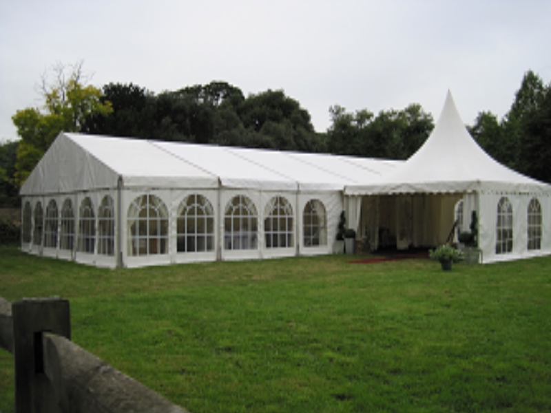 A marquee set up for a wedding in the meadow