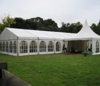 A marquee set up for a wedding in the meadow